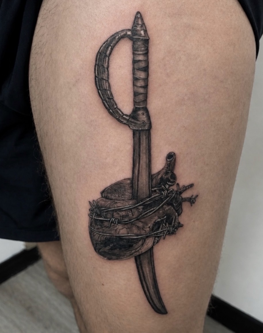 Military-inspired dagger tattoo by Jake Bebout at Snafu Tattoo Studio in Wilmington NC